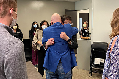 Jason Wu hugs David Ricks