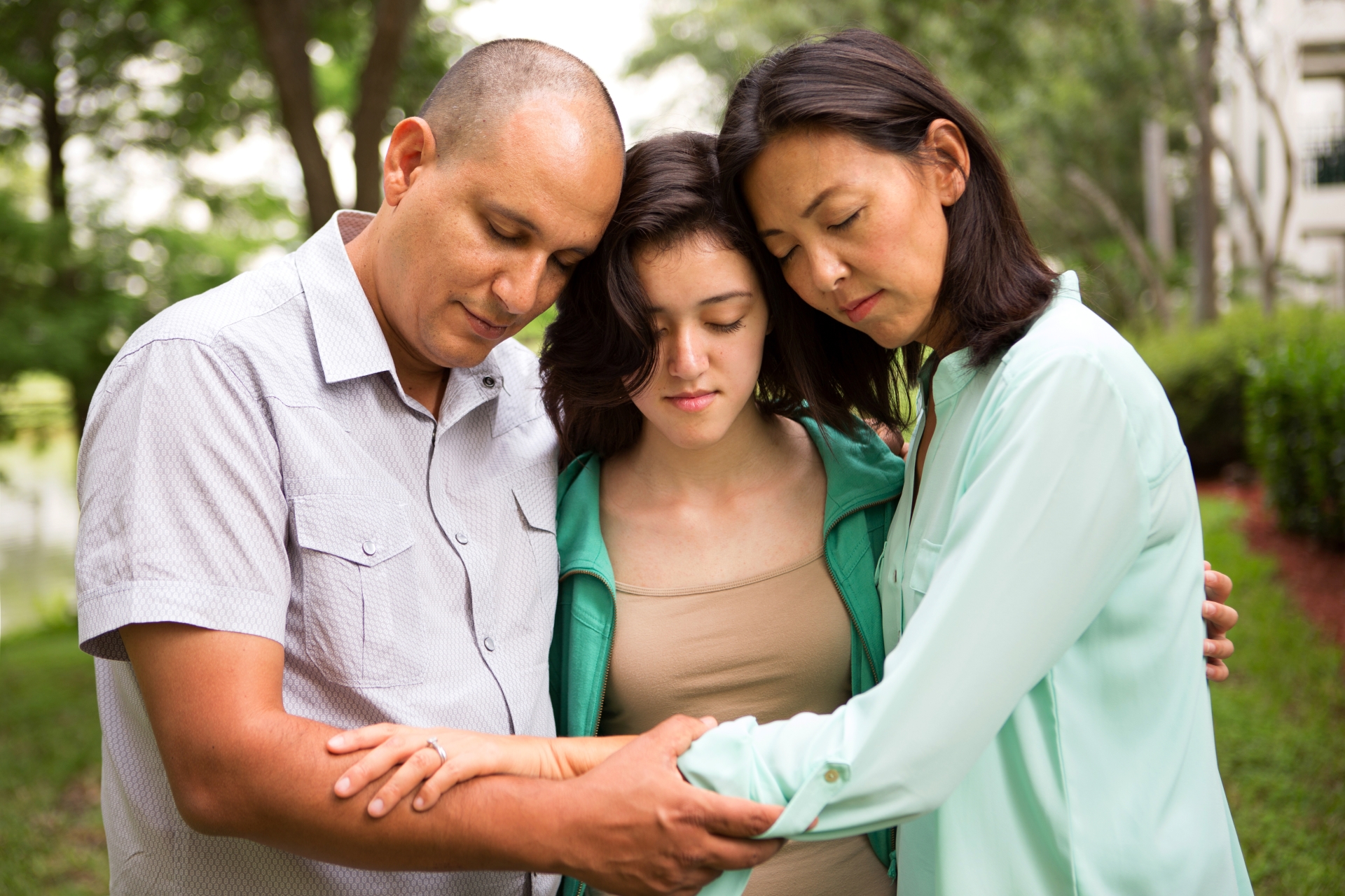 Three people in prayer