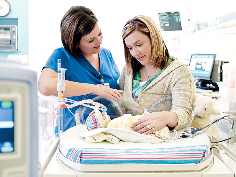 Nurse with mom and newborn