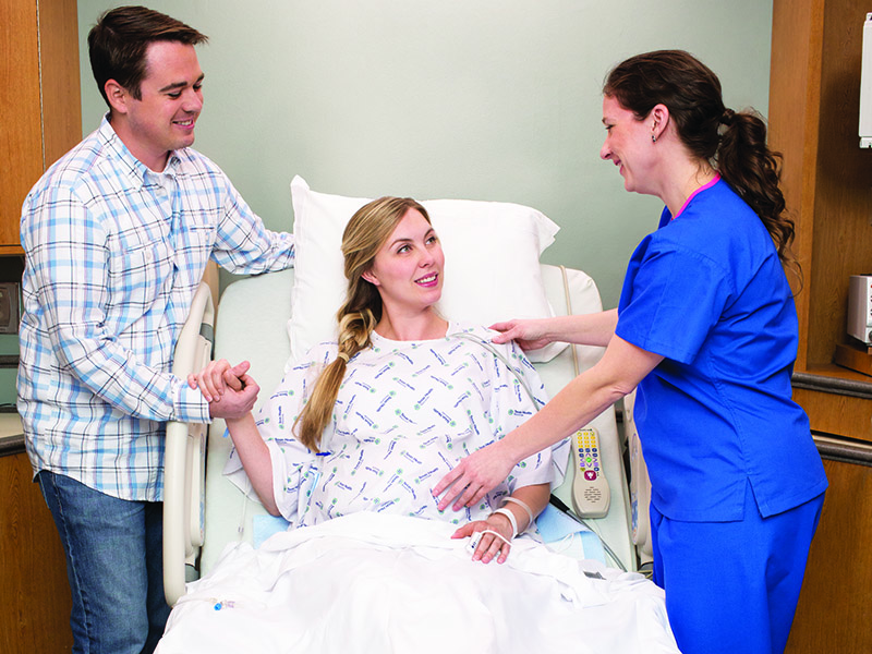 Couple and provider in delivery room