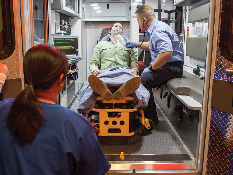 Man in Ambulance with Paramedics