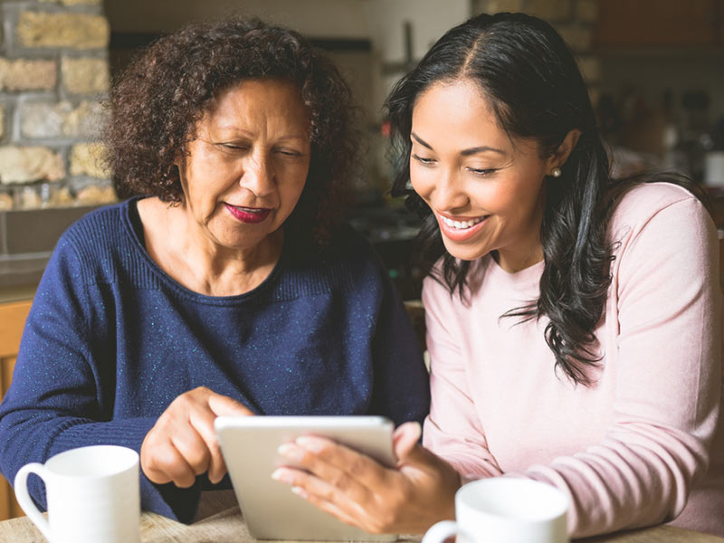 Mother and Daughter using tablet